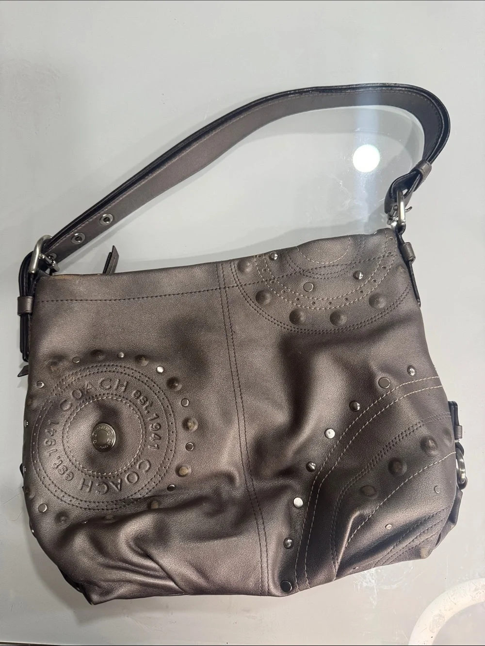 Coach Y2K Madison hobo bag featuring metallic pewter leather and silver studded